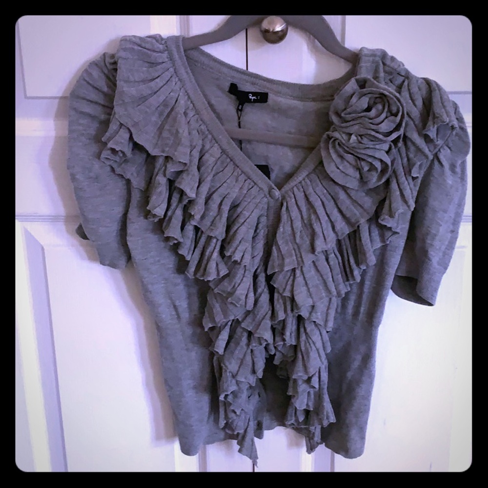A grey frilly blouse